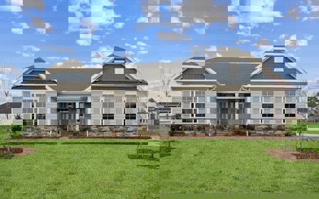 A house with a lawn in front.