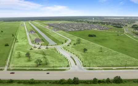 An aerial view of a road and fields.