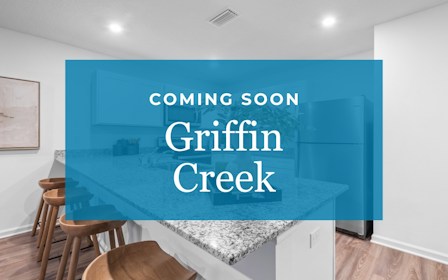 A room with a blue wall and stools.