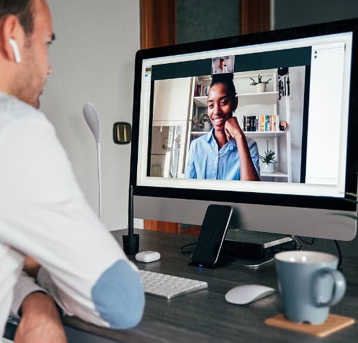 A man sitting in front of a computer.