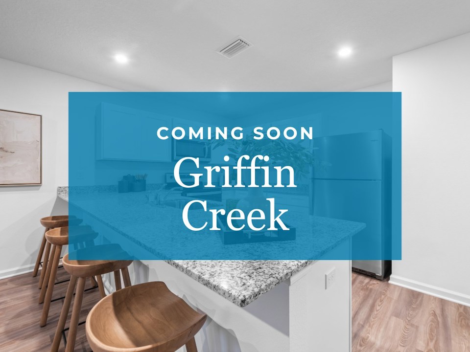 A room with a blue wall and stools.