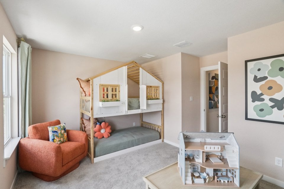 A living room with a bed and a couch.
