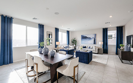 A large room with a table and chairs.