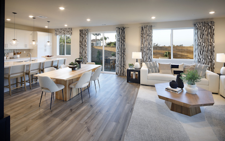 A large living room with a large window.