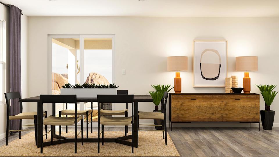 A room with a table and chairs.