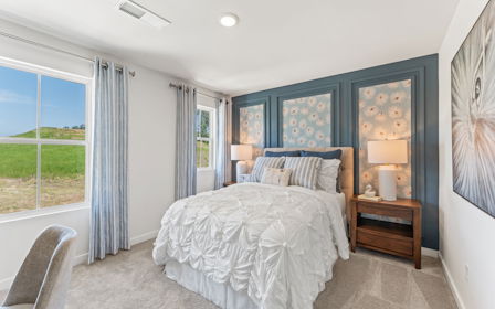 A bedroom with a bed and a window.