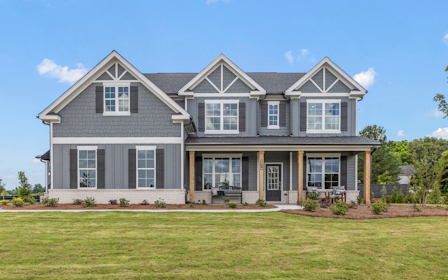 A house with a lawn in front.