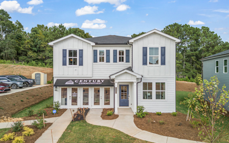 A white house with blue trim.