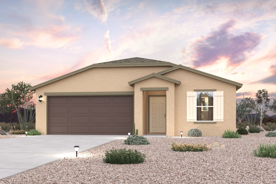 A house with a garage and bushes.