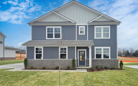 A house with a large front yard.