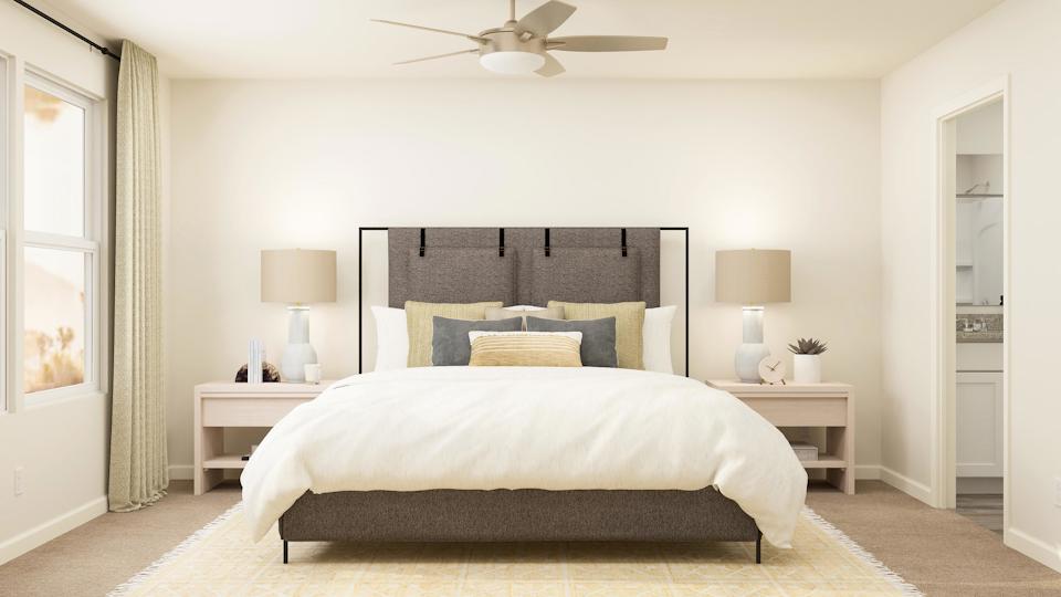 Spacious owner's suite with an attached bathroom and walk-in closet.