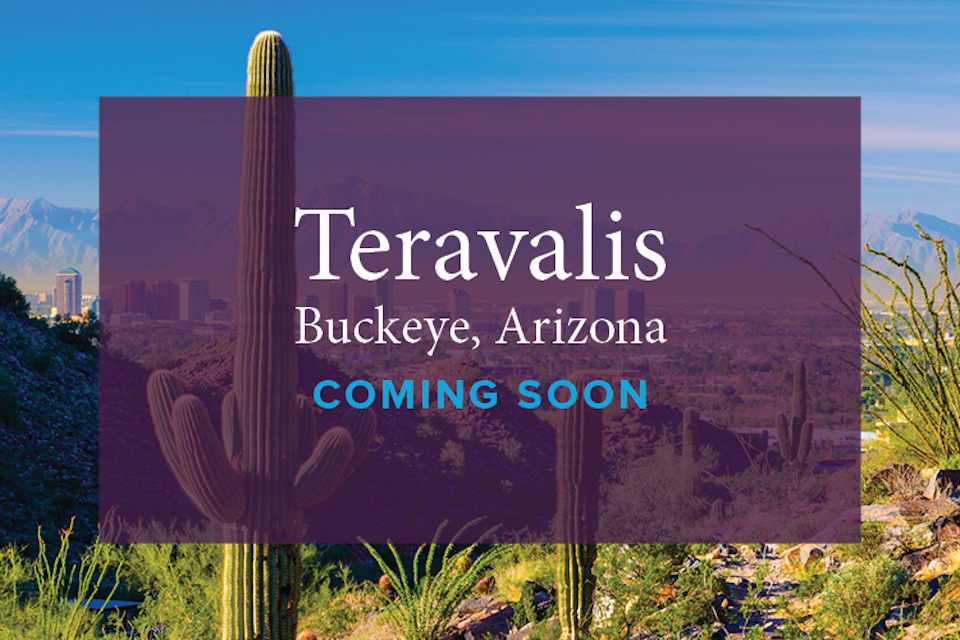 A sign with a city in the background.