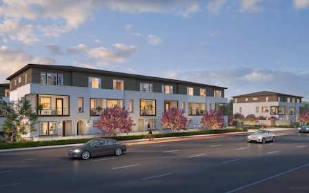 A street with cars and buildings along it.