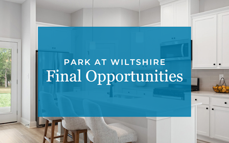 A kitchen with a blue wall.